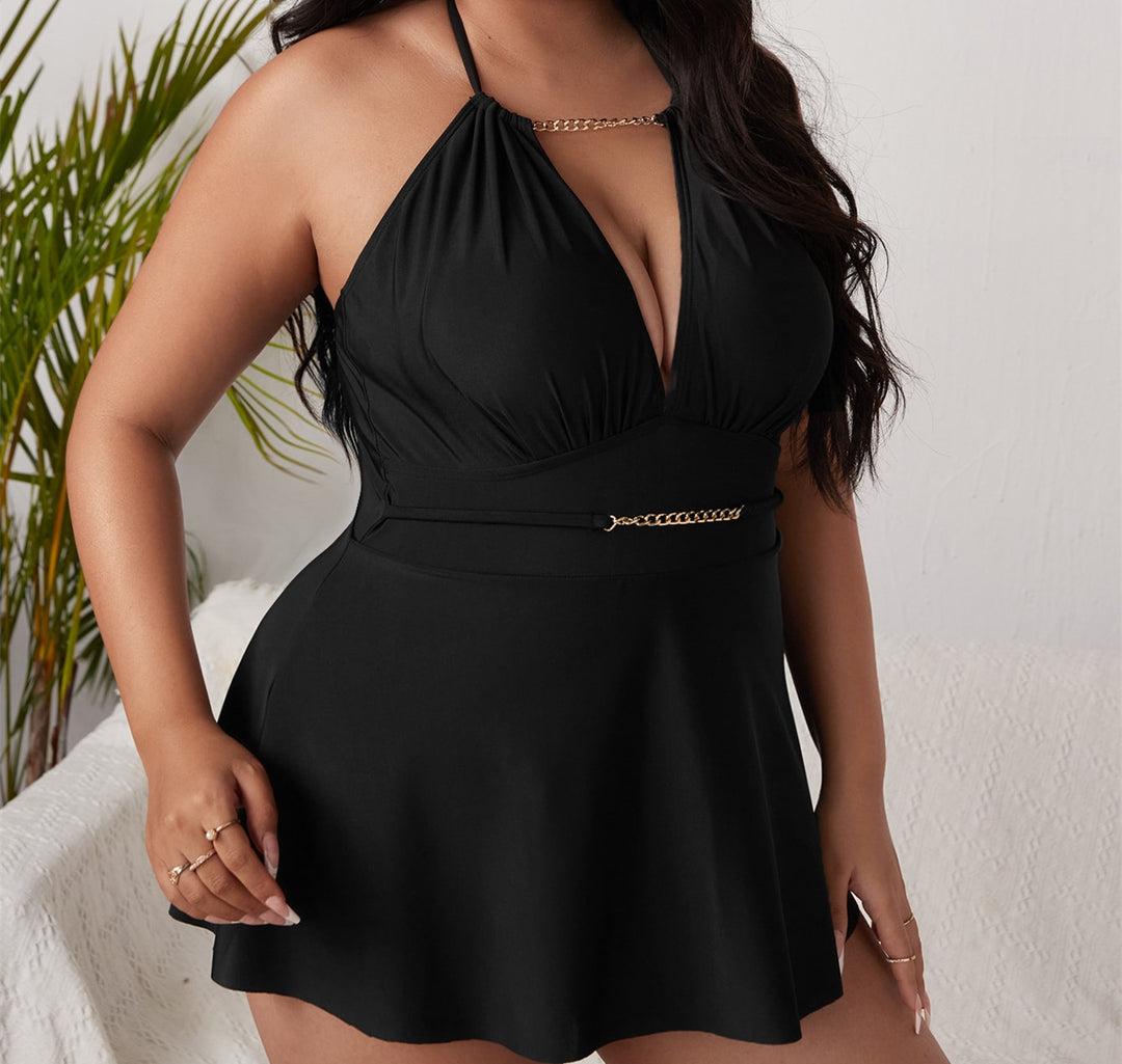 Women's beach dress with deep V-neck and decorative chain detail Mune Fashion