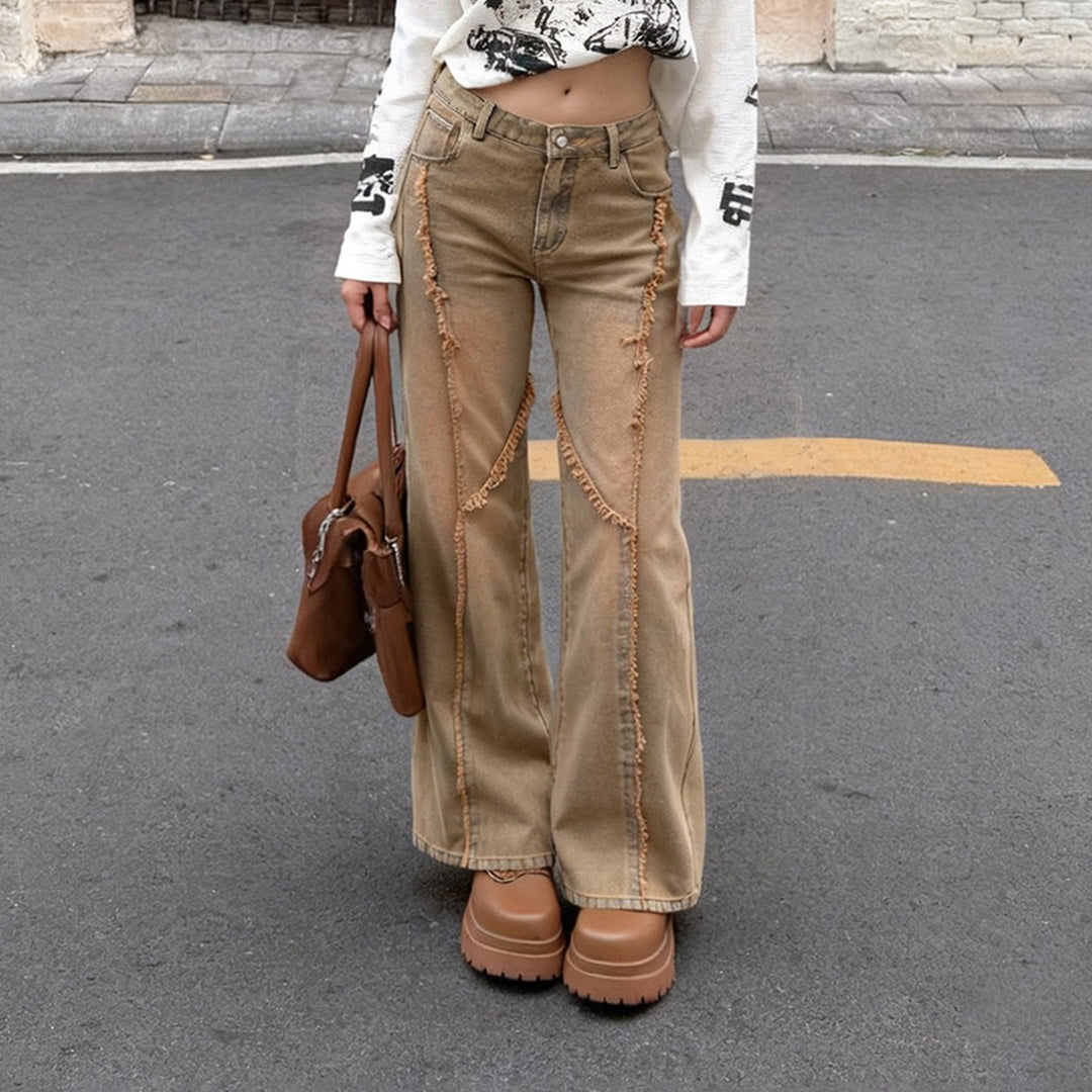 Women's high-waisted wide-leg jeans with raw hem seams, diagonal fringe trim, and relaxed fit Mune Fashion