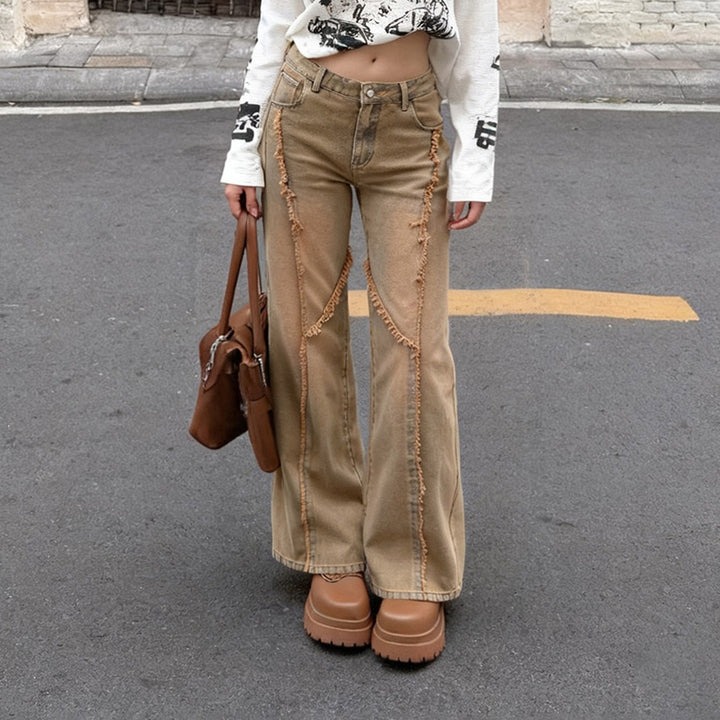 Women's high-waisted wide-leg jeans with raw hem seams, diagonal fringe trim, and relaxed fit Mune Fashion