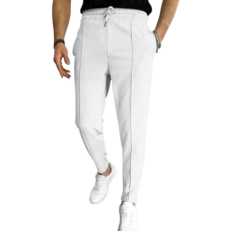 Men's tapered jogging chinos made of structured woven quality with elastic drawstring waistband and decorative crease Mune Fashion