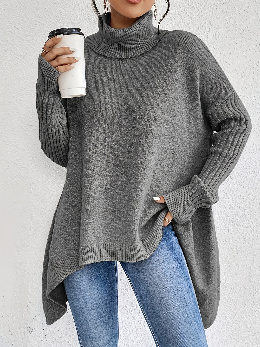 Women's oversized knit sweater with high turtleneck, ribbed sleeves, and asymmetric hem Mune Fashion