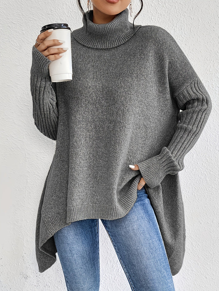 Women's oversized knit sweater with high turtleneck, ribbed sleeves, and asymmetric hem Mune Fashion
