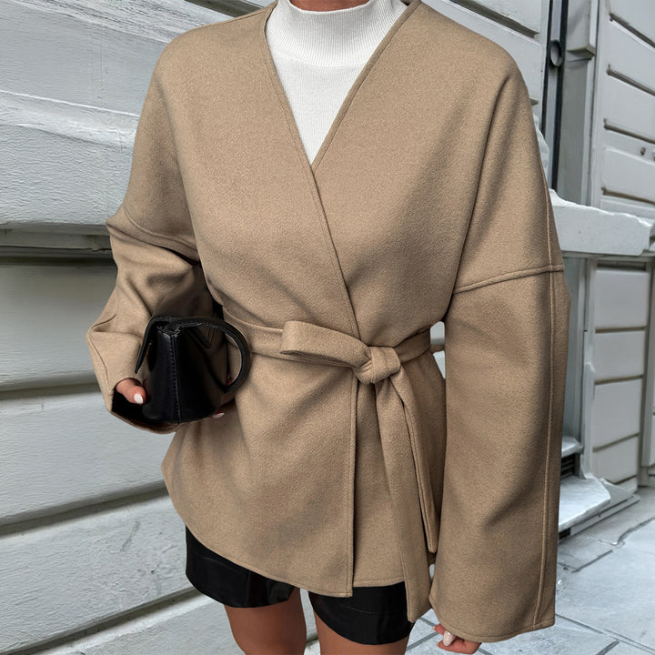 Women’s light wrap coat with tie belt, dropped sleeves and feminine waist emphasis Mune Fashion