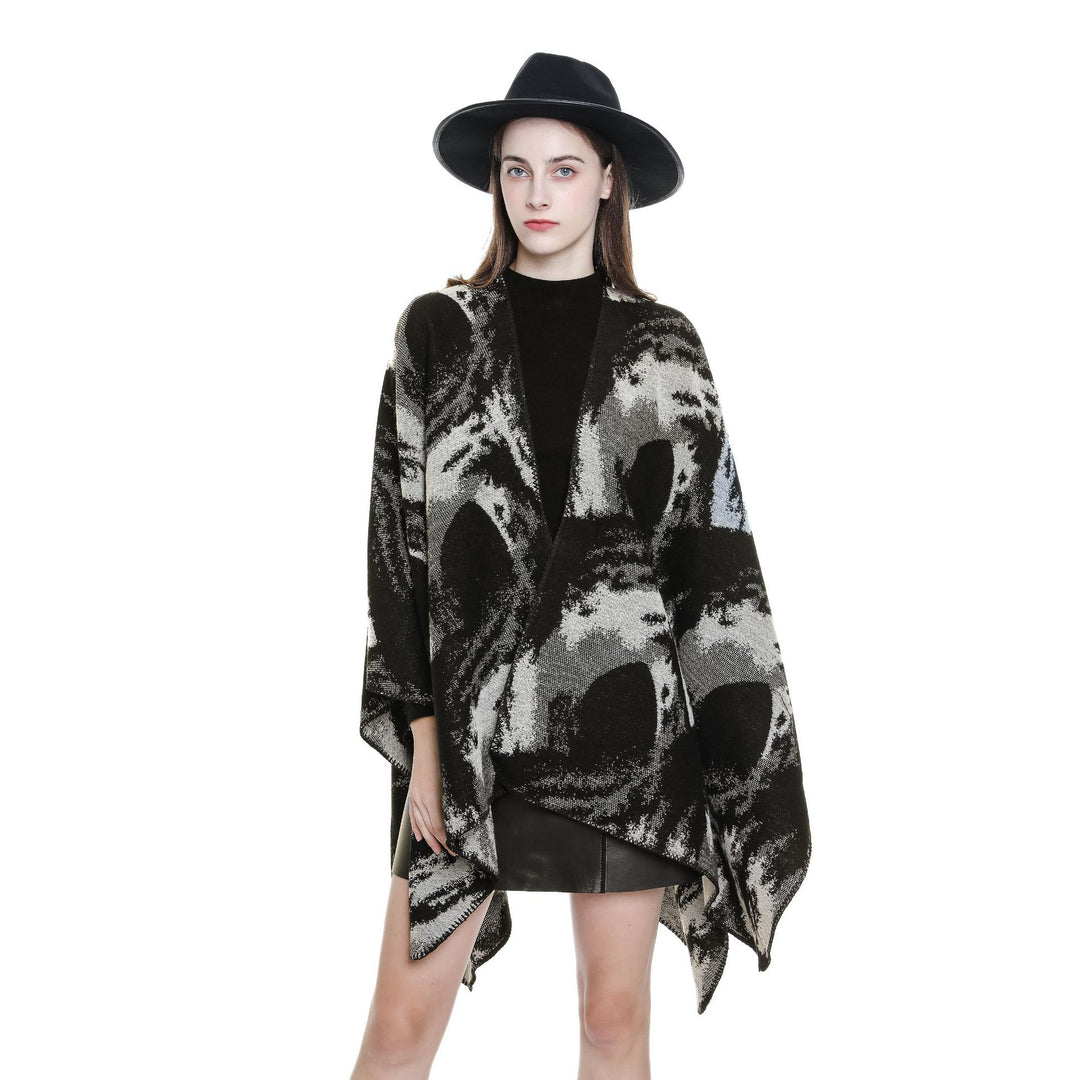 Ladies oversized jacquard cape made of wool blend with graphic watercolor pattern and overlock edge Mune Fashion