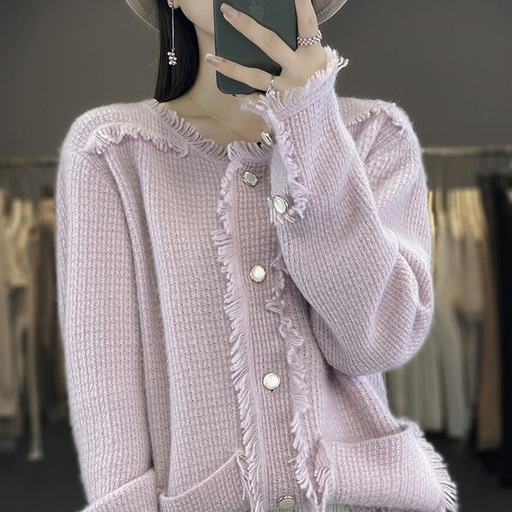 Women's knitted cardigan with fringe trim, mother-of-pearl button placket, and patch pockets Mune Fashion