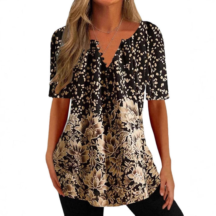 Women’s loose V-neck tunic top with floral trim and polka dot pattern Mune Fashion