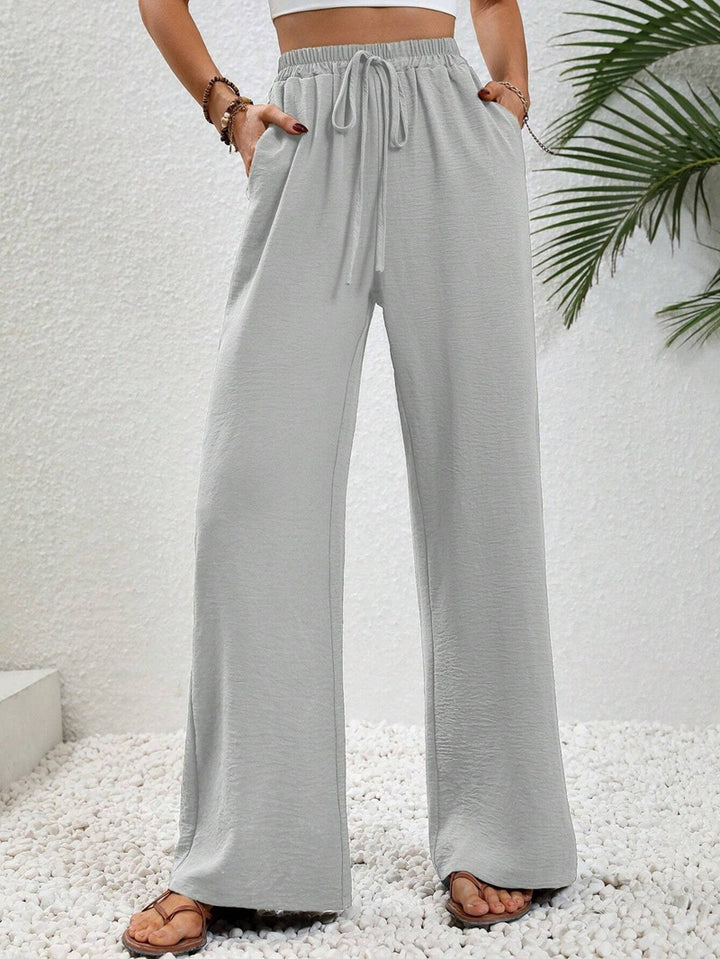 Ladies lightweight, loose-fitting beach pants with elastic waistband, drawstring and side pockets Mune Fashion