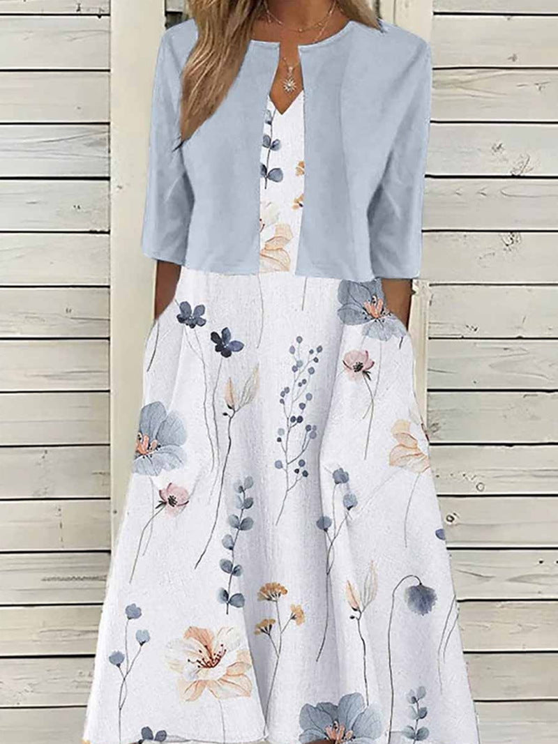 Women's midi dress with bolero look, fitted V-neck, three-quarter sleeves, and floral A-line skirt Mune Fashion