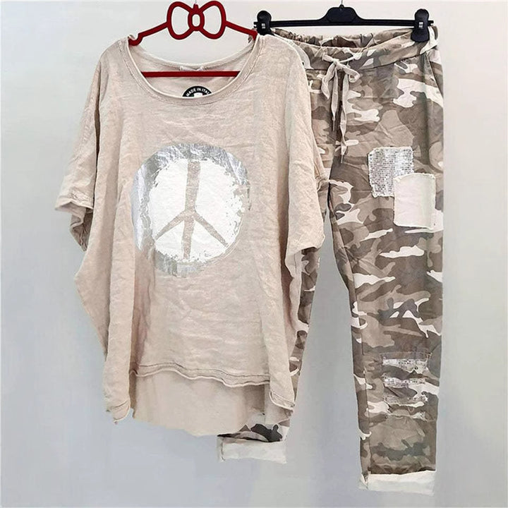 Women’s casual leisure two-piece with wide-cut linen look shirt, peace symbol and camouflage jog pants with patch details Mune Fashion