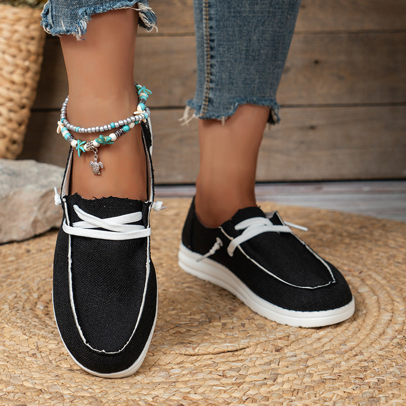 Women’s lightweight canvas slip-ons with decorative lacing, padded comfort insole, and slip-resistant lightweight sole Mune Fashion