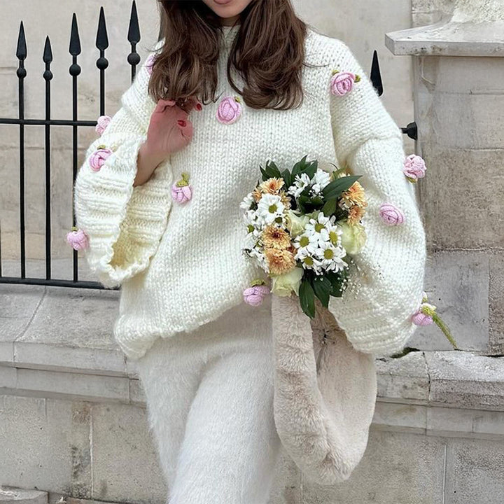 Women's oversized knit sweater with 3D floral appliqués and wide trumpet sleeves Mune Fashion