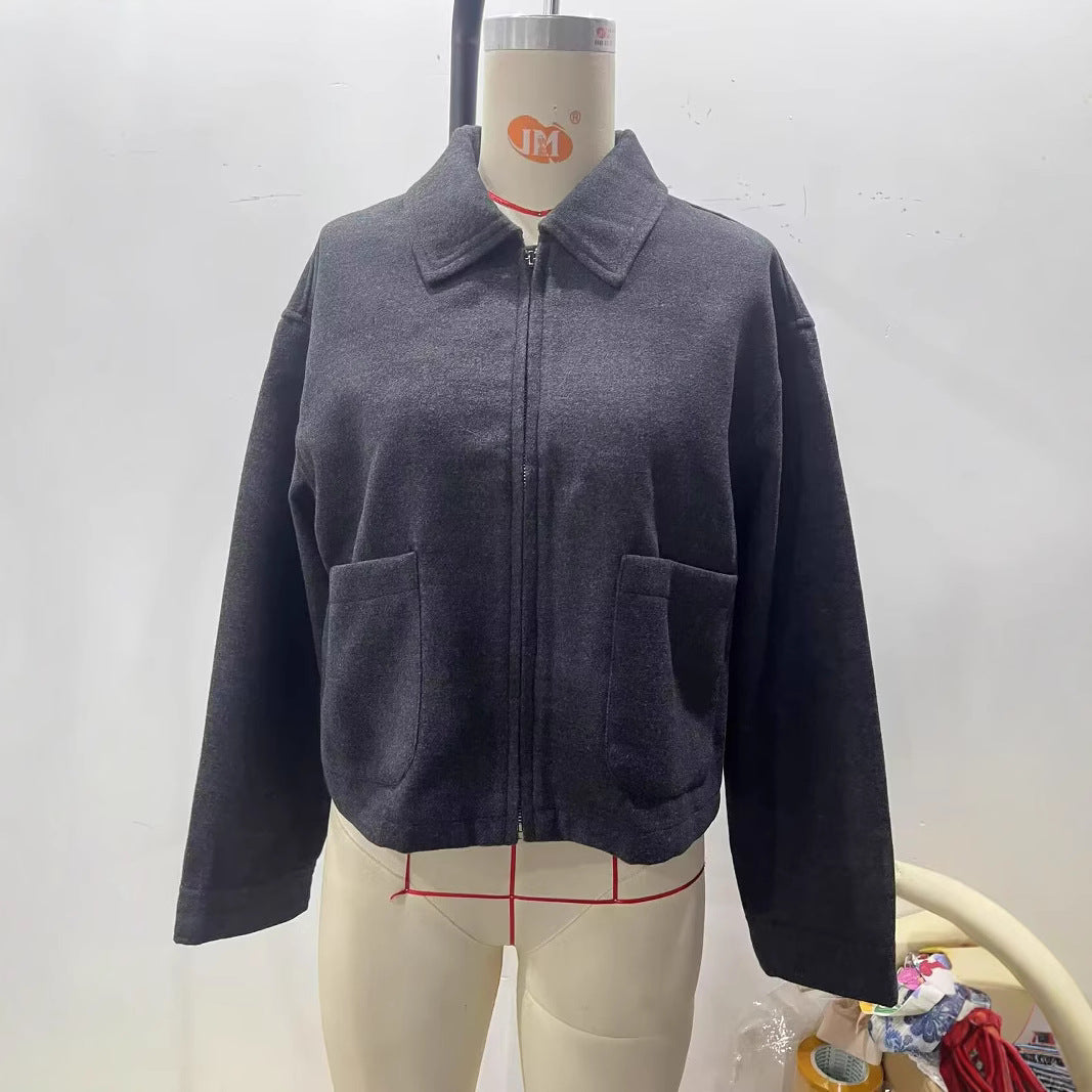 Women's tailored cropped blouson jacket in shirt collar style with concealed zipper front and large appliquéd pockets Mune Fashion