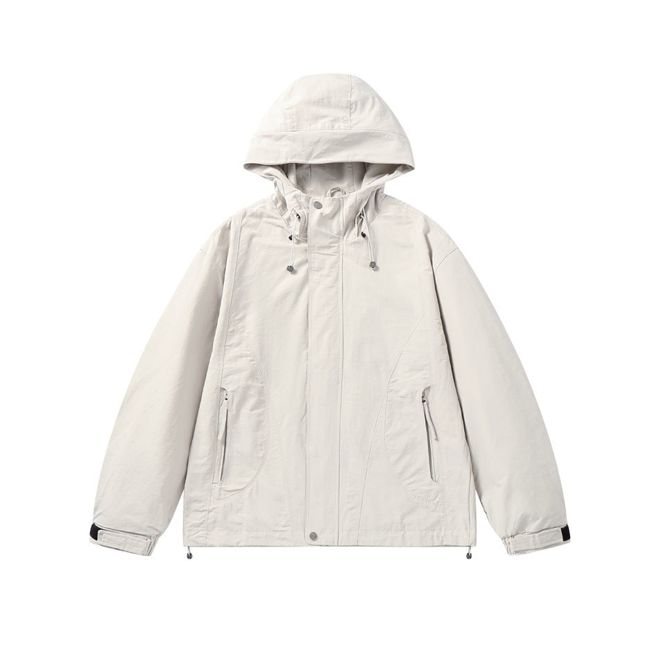 Unisex Light windproof hooded jacket in boxy cut with drawstring and concealed front Mune Fashion