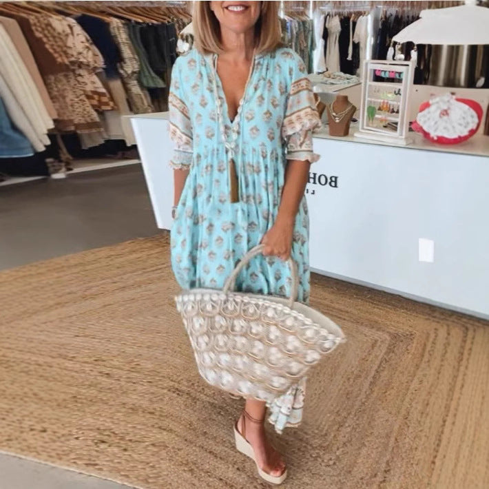 Women Boho Maxi Dress made of lightweight viscose blend with V-neck, tassel tie, three-quarter sleeves, and side pockets Mune Fashion