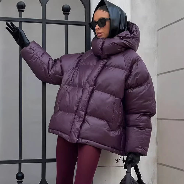 Ladies short padded oversized quilted jacket with high standing collar and hood Mune Fashion