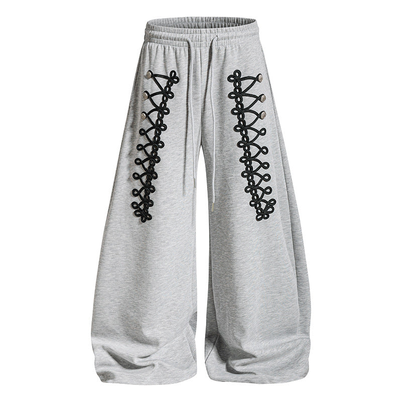 Women's loose jogging pants with elastic waistband and decorative lacing Mune Fashion