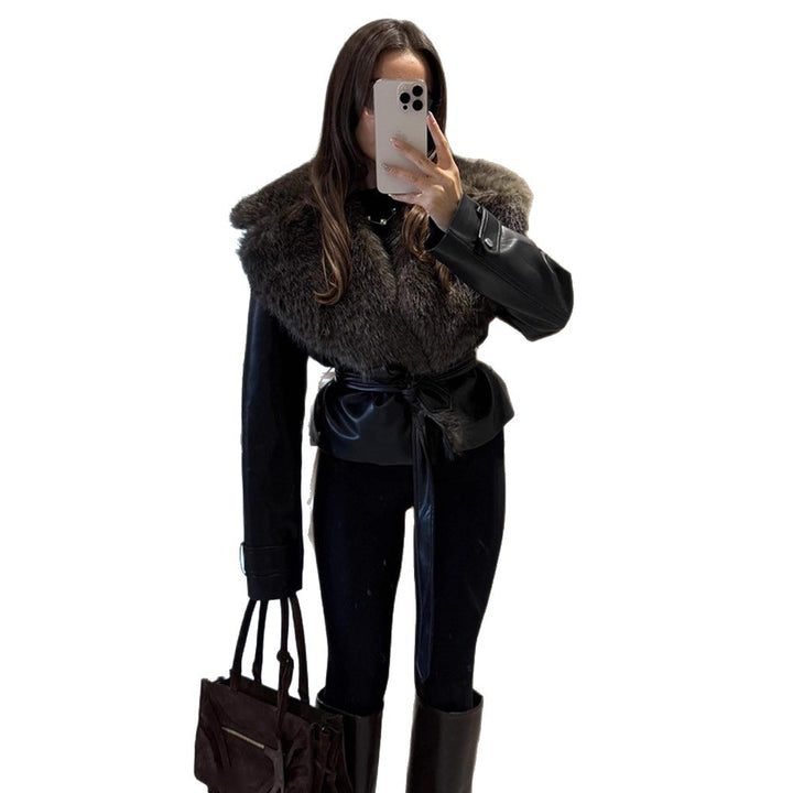 Women's short jacket in biker blouson style made of imitation leather with voluminous faux fur shawl collar and waist belt Mune Fashion