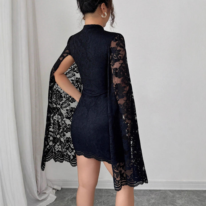 Women's fitted lace mini dress with high stand-up collar and dramatic cape sleeves Mune Fashion