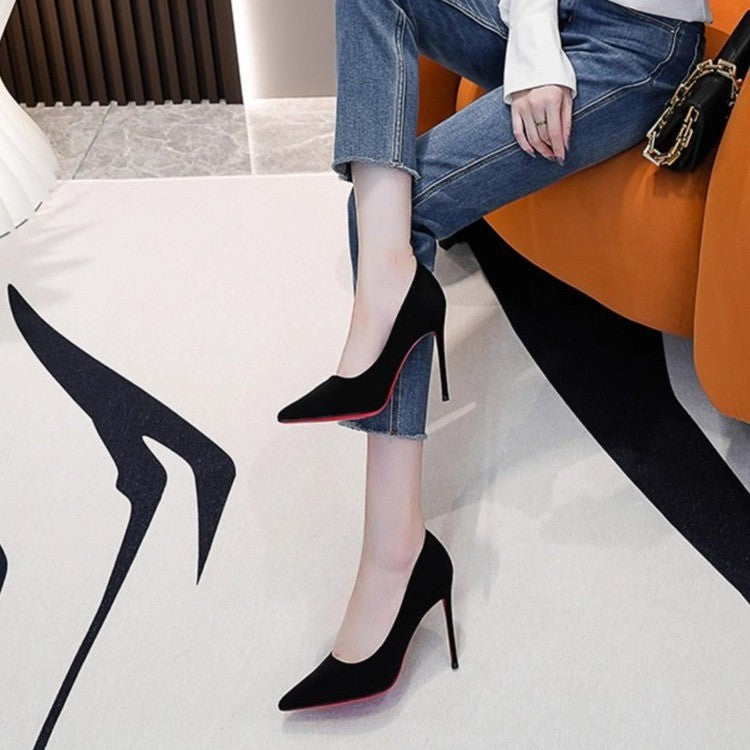 Ladies elegant pointed suede pumps with contrasting red sole and narrow stiletto heel