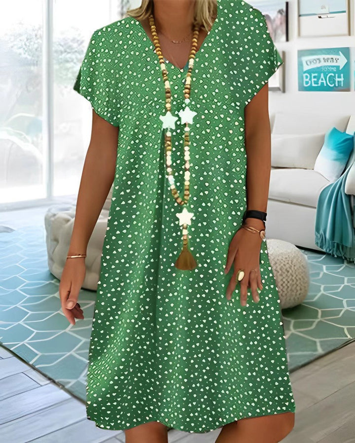 Ladies nan locker falling V-neck short dress with A-line cut, cap sleeves and all-over heart print Mune Fashion