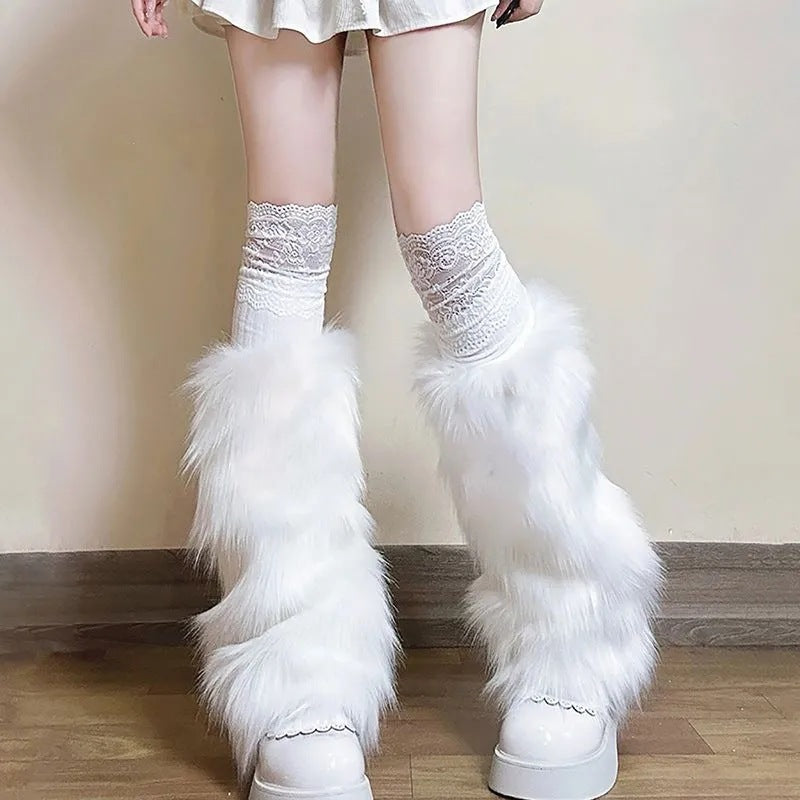 Ladies cozy boot cuffs made of faux fur with bow appliqué and pompons Mune Fashion