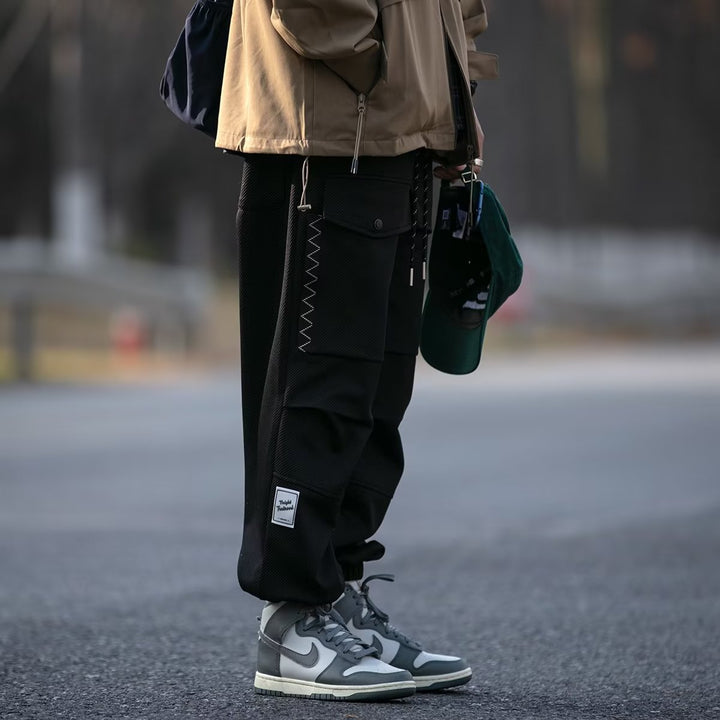 Men's wide cargo jogging pants with drawstring, flap pockets, and elastic cuffs Mune Fashion