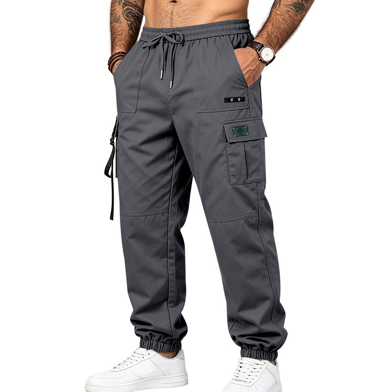 Men's utility cargo pants in jogger style with elastic waistband, multiple pockets and leg straps Mune Fashion