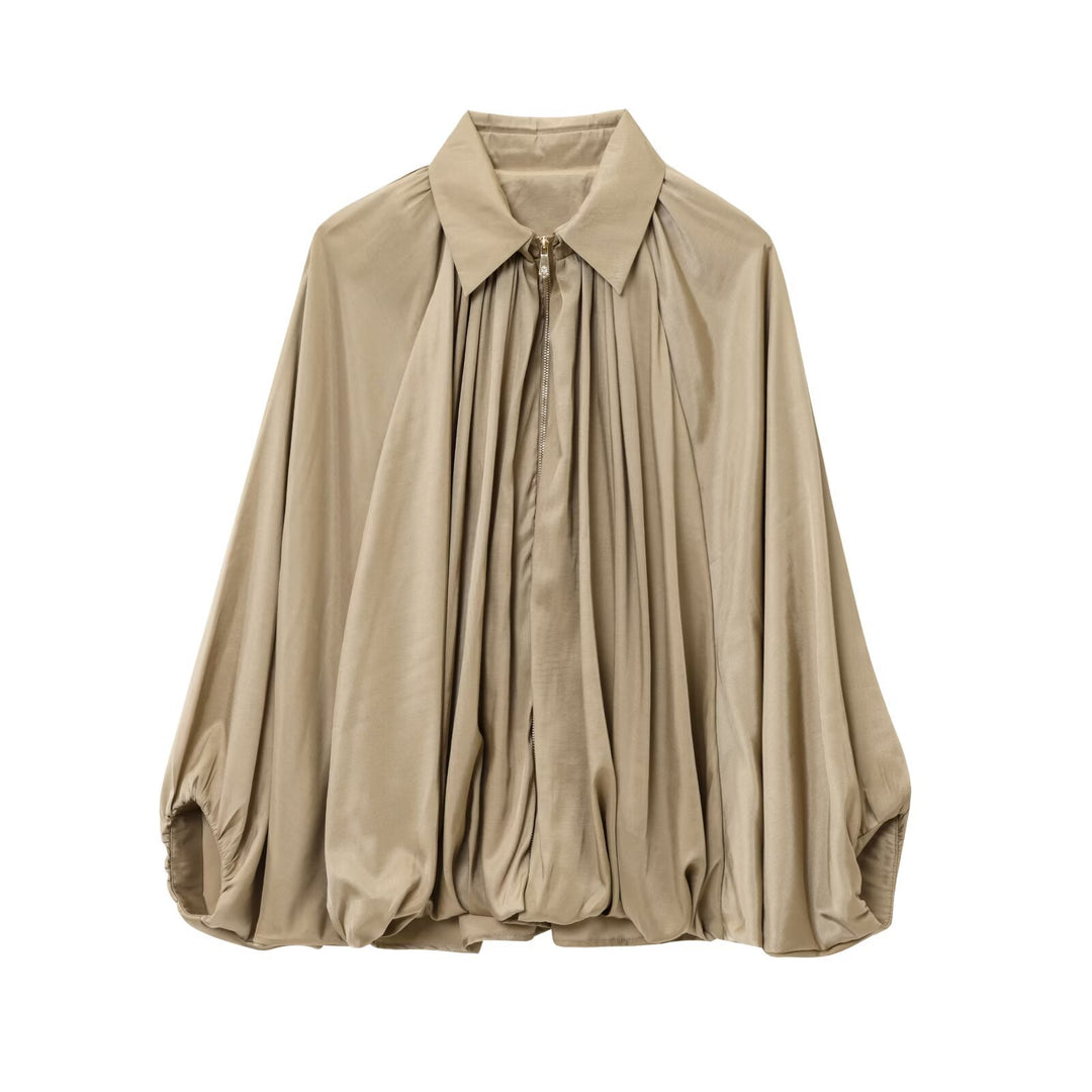 Women's loosely cut cape blouse with continuous zipper, ballooned hem, and gathered sleeves Mune Fashion
