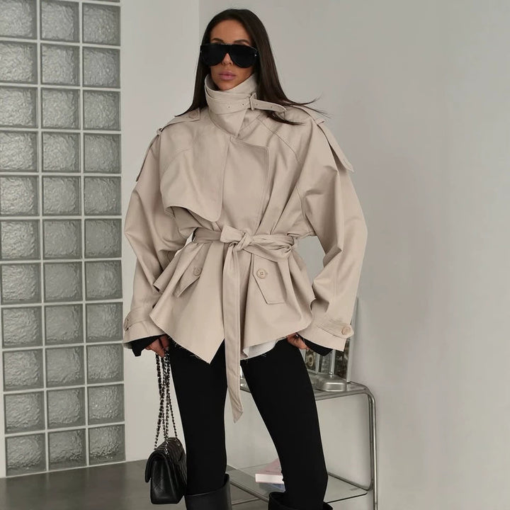 Women's short trench coat with wide standing collar, shoulder epaulettes, and waist belt Mune Fashion