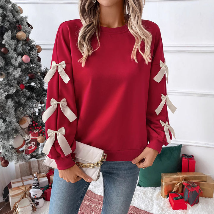 Women's sweatshirt with decorative bows on the sleeves Mune Fashion