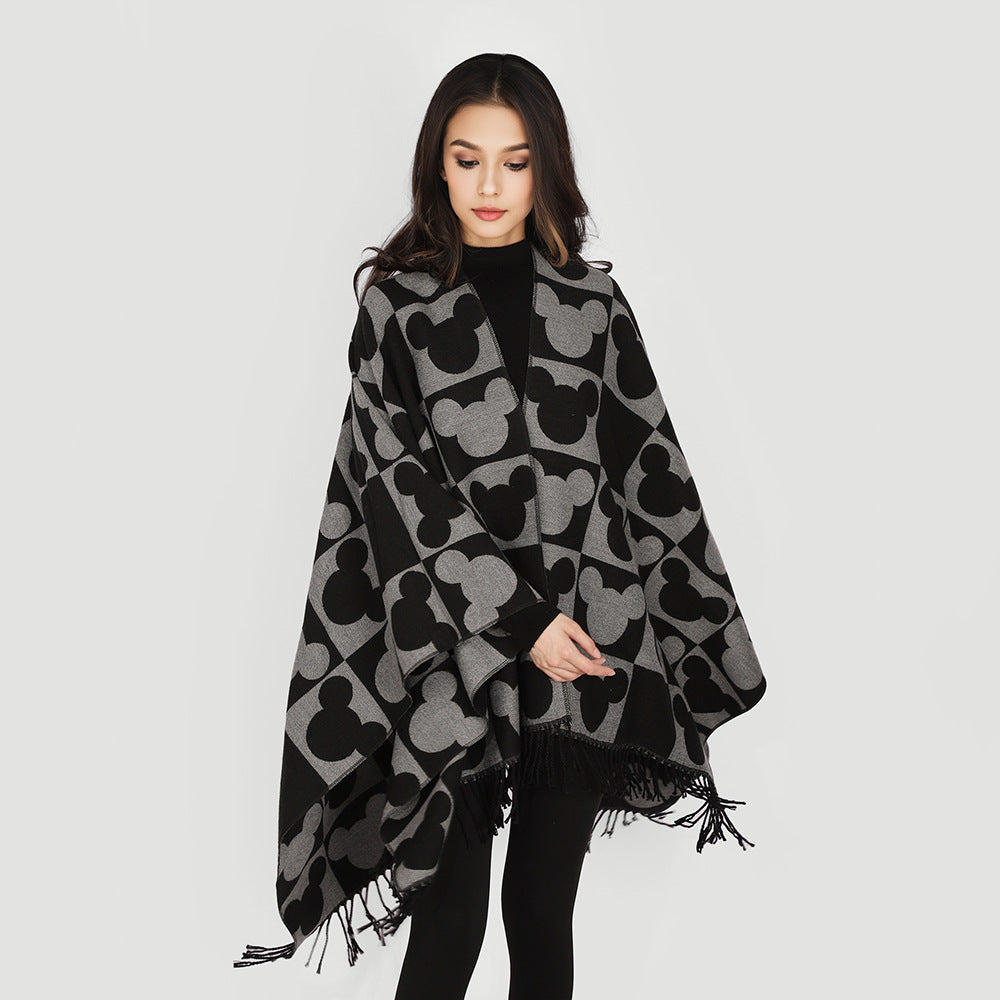 Women's jacquard poncho with figurative head silhouette pattern, fringe and open drape