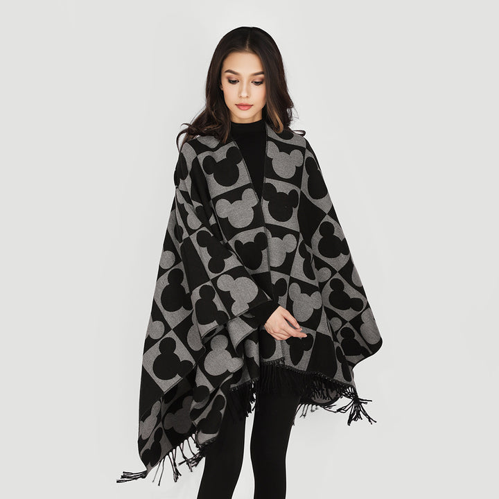 Women's jacquard poncho with figurative head silhouette pattern, fringe and open drape