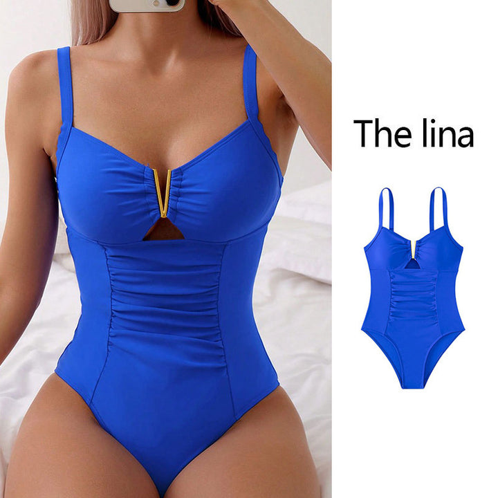 Ladies sophisticated one-piece swimsuit with decorative cut-out and flattering ruffle details Mune Fashion