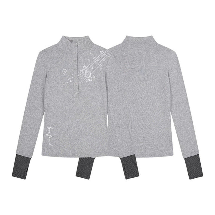 Women’s long-sleeve shirt with Henley button placket, contrast cuffs, and music note print Mune Fashion