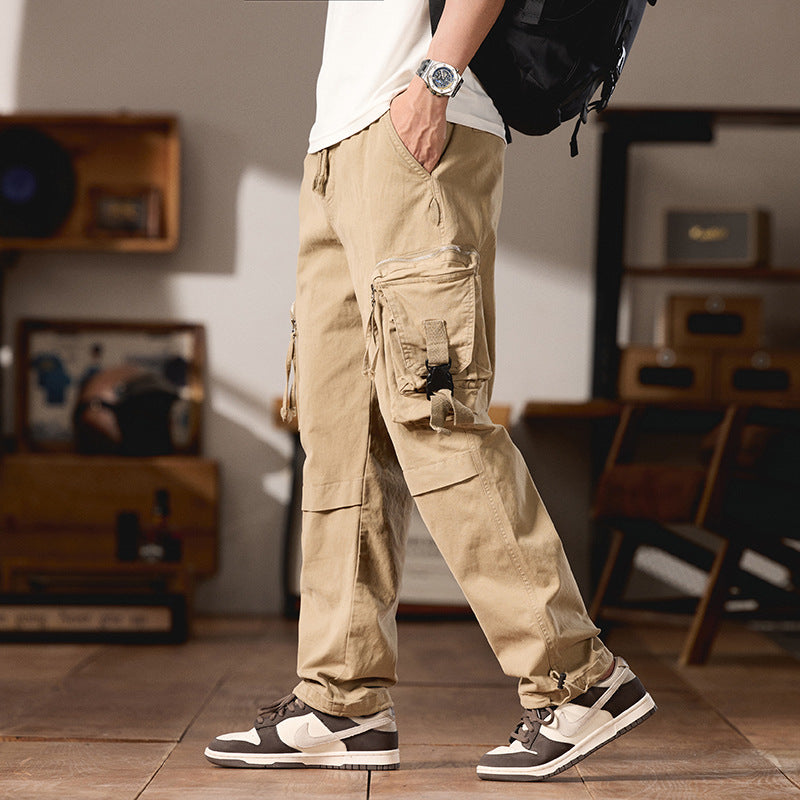 Men's multifunctional cargo pants in utility style with large flap and zip pockets, drawstring closure, and sturdy twill Mune Fashion