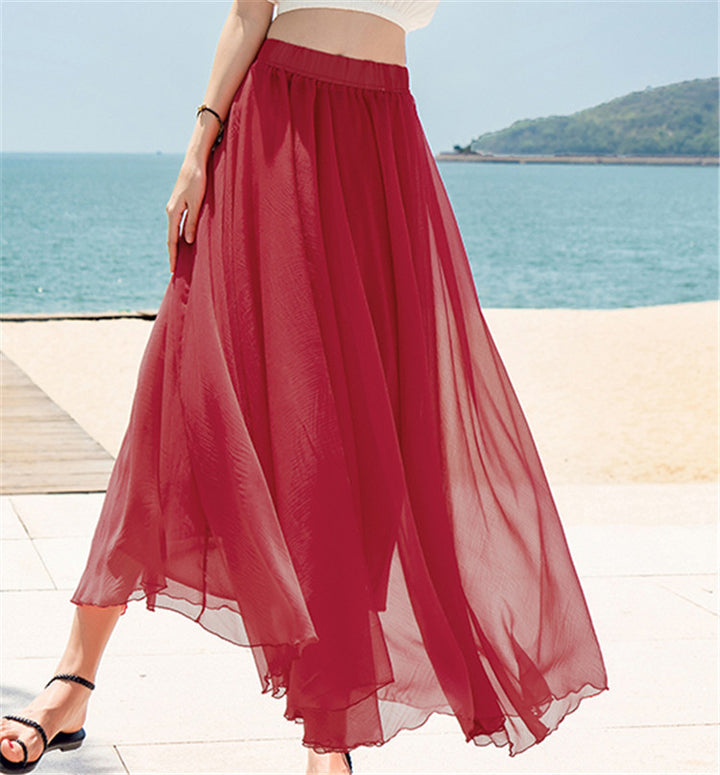 Women's flowing maxi skirt made of chiffon with elastic waistband and layered ruffle Mune Fashion