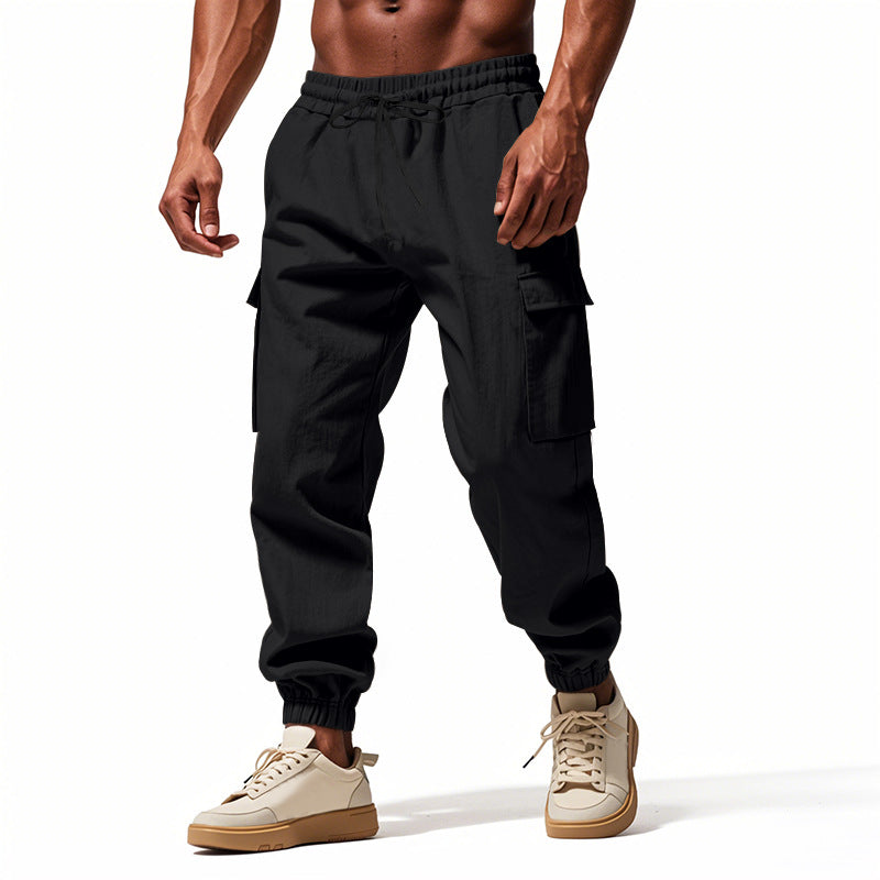 Men's tapered joggers in utilitarian style with elastic waistband, drawstring, and flap pockets Mune Fashion