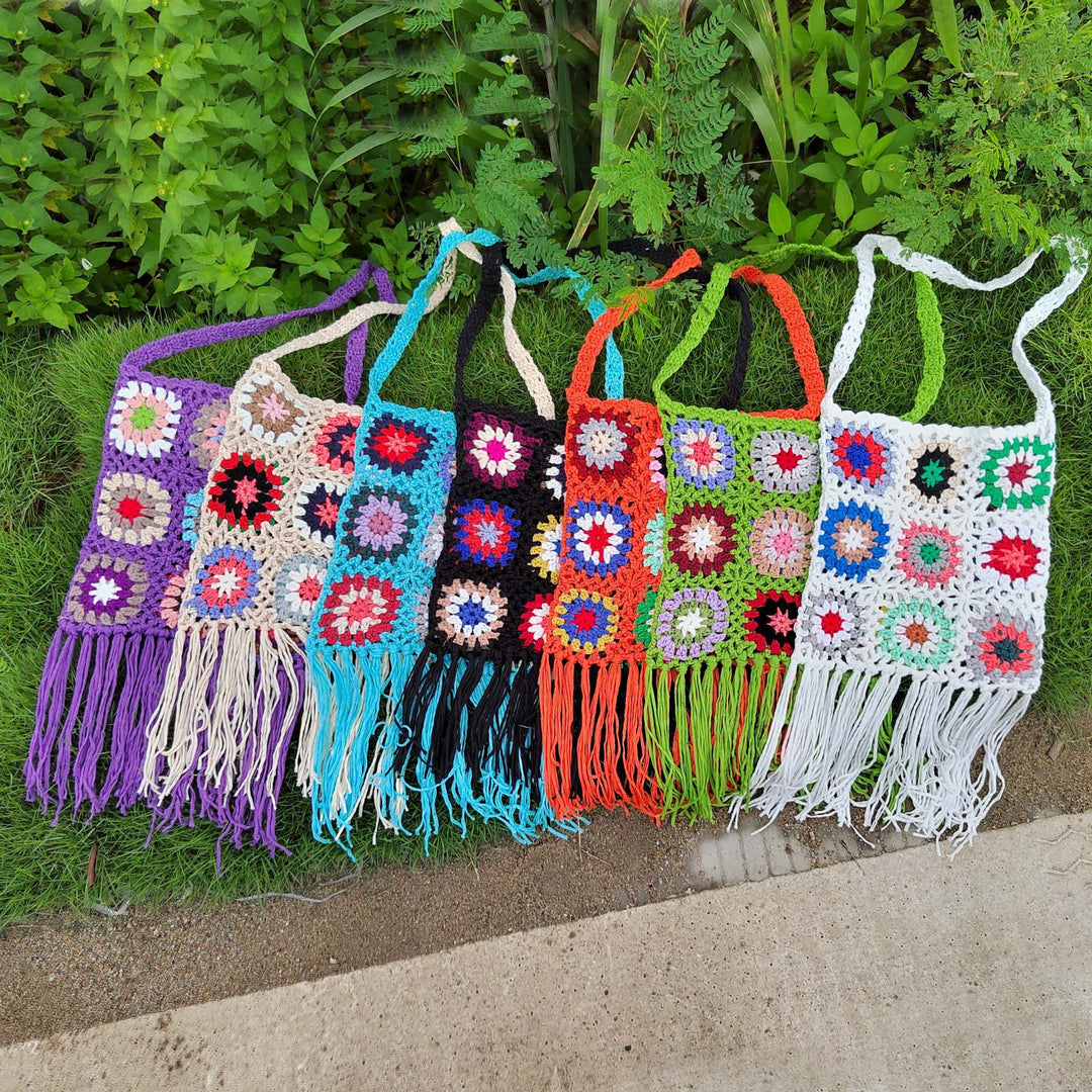 Women crocheted shoulder bag with colorful floral patterns and fringes Mune Fashion