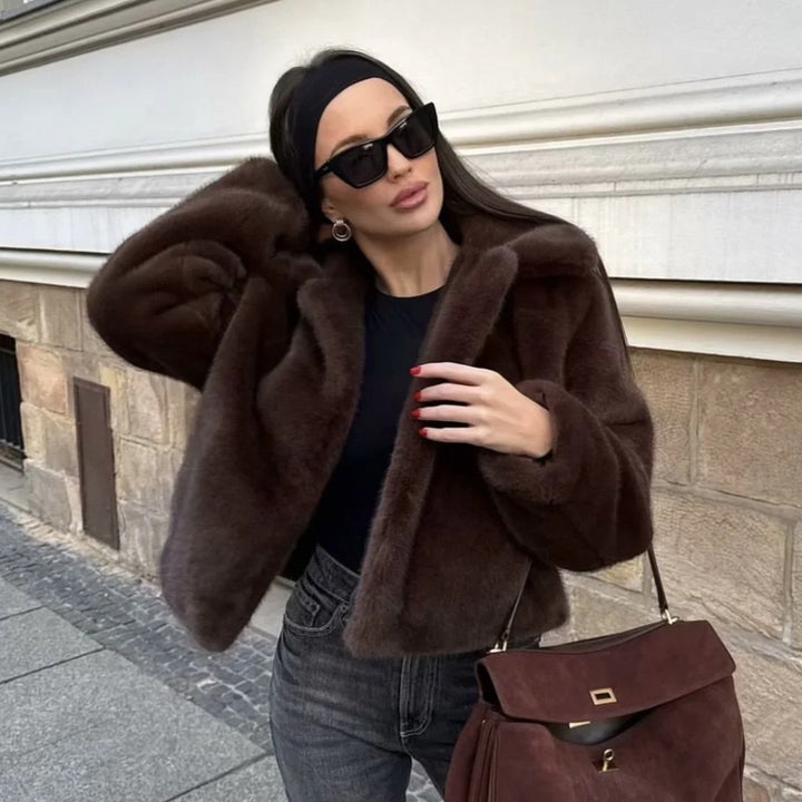 Women's short-cut faux fur jacket with notched collar, soft inner lining, and cool cropped silhouette Mune Fashion