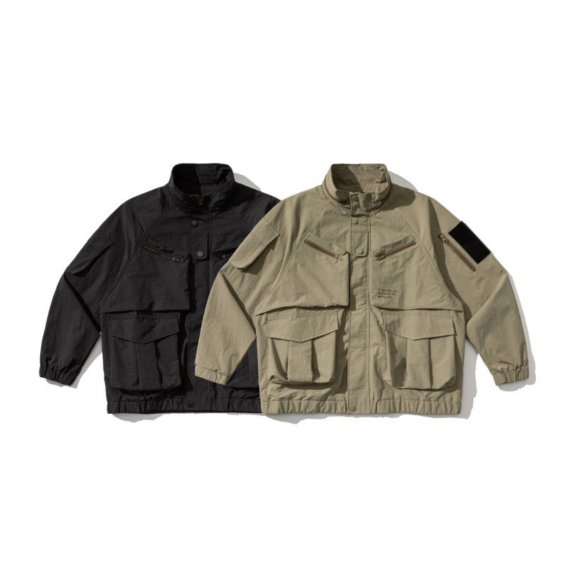 Unisex Oversize Utility Jacket with multifunctional pockets, high stand-up collar, and elastic hem Mune Fashion