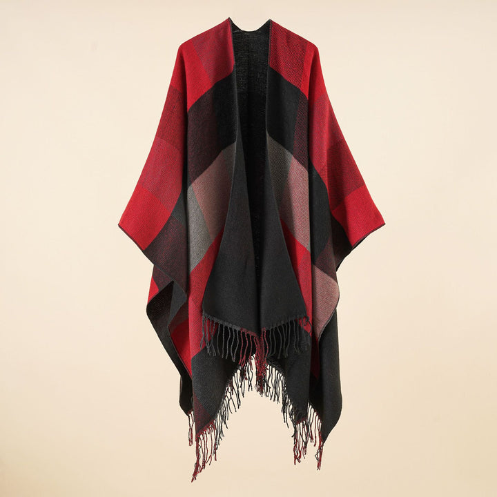 Women’s web cape in a boxy ruana cut with diagonal check pattern and fringes