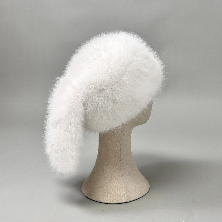 Women’s plush faux fur trapper hat with earflaps and decorative tail Mune Fashion