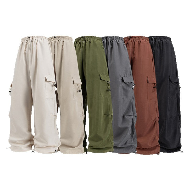 Men's wide technical cargo pants with drawstring waistband, multiple pockets and corded closure Drune
