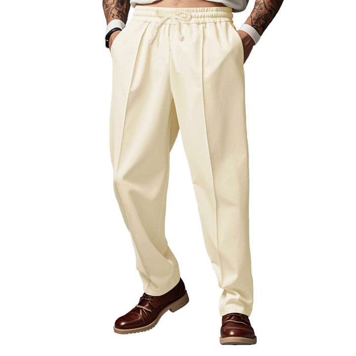 Men's slim tapered jogging pants with elastic tunnel drawstring, shaping crease, and side pockets Mune Fashion