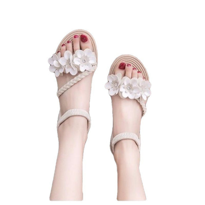 Women's playful strap sandal with braided decorative bands, flower appliqués, and elastic heel strap Mune Fashion