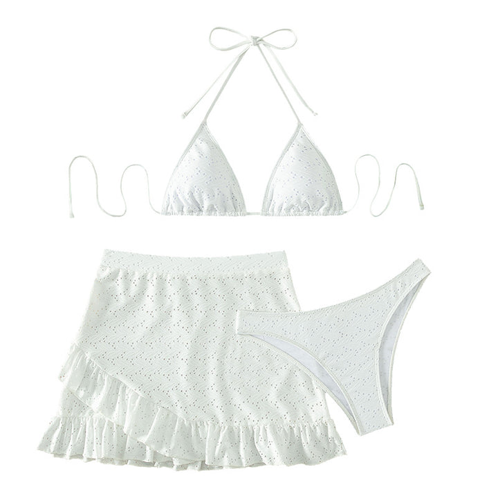 Women's triangle bikini with playful hole pattern and matching skirt Mune Fashion