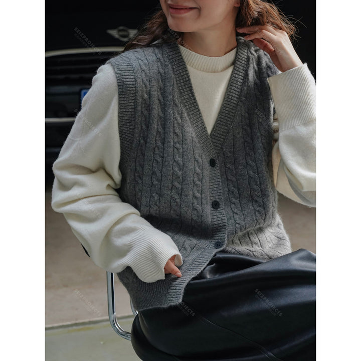 Women's chunky knit cable vest with deep V-neck and button placket Mune Fashion