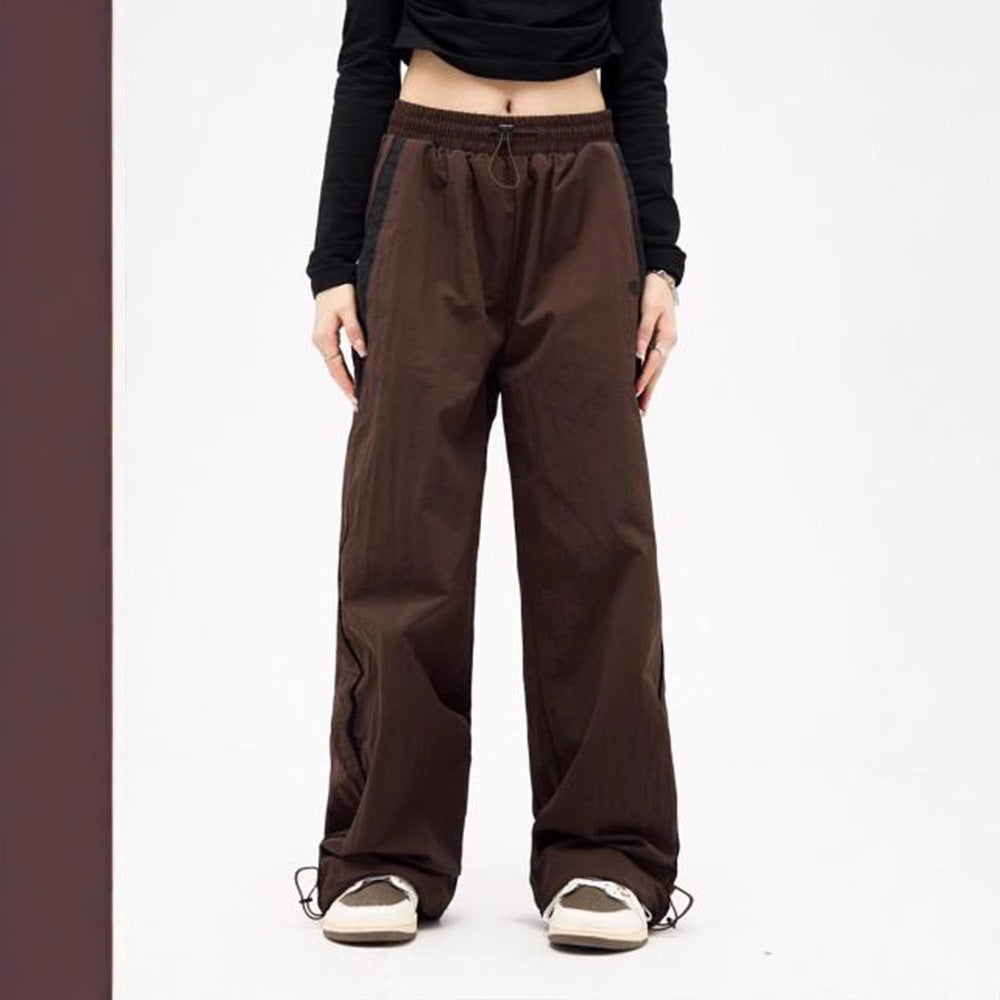 Women's wide track pants with contrast piping, elastic waistband and oversized fit Mune Fashion