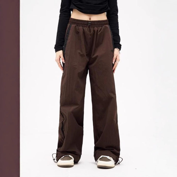Women's wide track pants with contrast piping, elastic waistband and oversized fit Mune Fashion