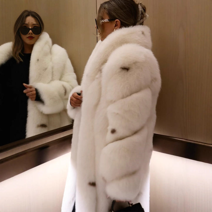 Women longer vegan faux fur coat with hood and voluminous fur collar Mune Fashion